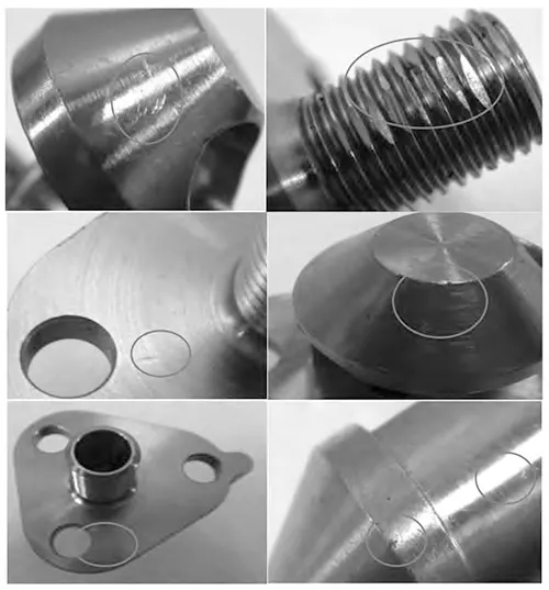 Figure 3 Photographs showing indentation and scratches on the nozzle housing Figure 3 Photographs showing indentation and scratches on the nozzle housing